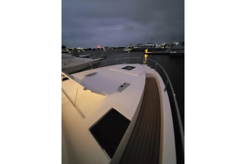 Slide: The Image of Cobra Yachts Seamaster 45, 2026 model, docked at twilight with surrounding boats. - 72