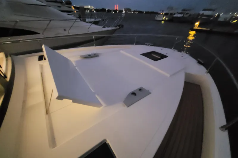 Slide: The Image of Cobra Yachts Seamaster 45, 2026 model, docked at night with illuminated deck. - 74