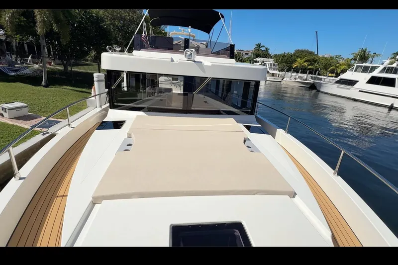 Slide: The Image of Luxury Cobra Yachts Seamaster 45, 2026 model, docked with spacious sun deck and sleek design. - 79