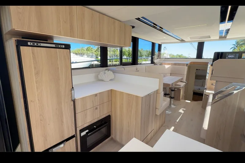 Slide: The Image of Luxurious interior of 2026 Cobra Yachts Seamaster 45 with modern kitchen and dining area. - 9