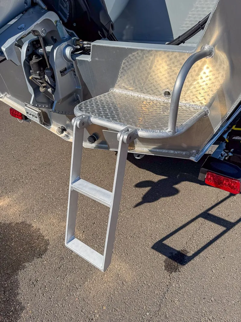 Slide: The Image of Hewescraft 200 ProV 2025 with rear ladder and platform. - 16