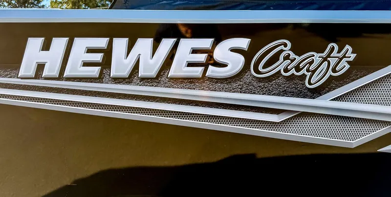 Slide: The Image of Close-up of Hewescraft 200 ProV 2025 boat logo. - 19