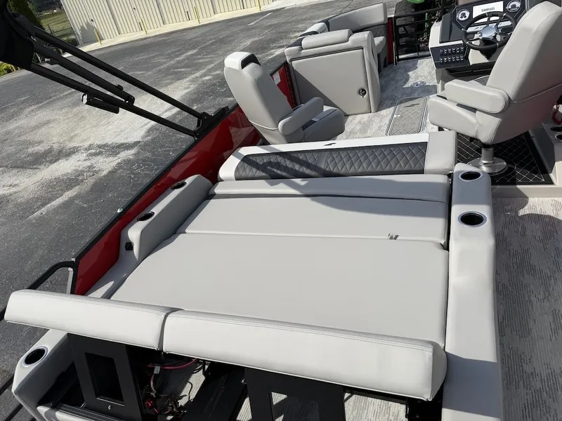 Slide: The Image of 2026 Starcraft SLS 3 Q DH pontoon boat interior with luxurious seating. - 13