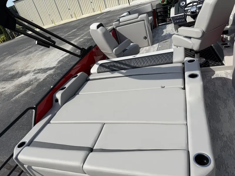 Slide: The Image of 2026 Starcraft SLS 3 Q DH boat with luxurious seating and helm console. - 14