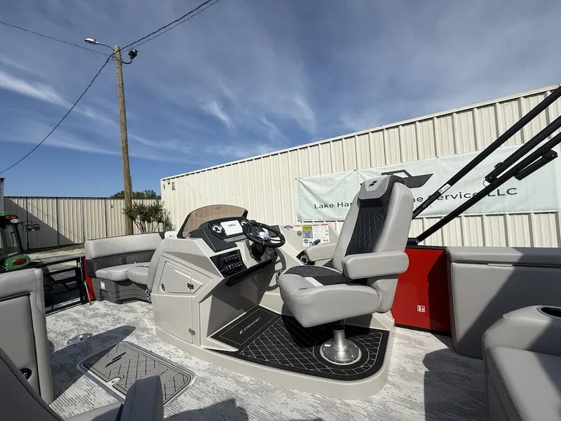Slide: The Image of Interior of 2026 Starcraft SLS 3 Q DH boat with helm console. - 16