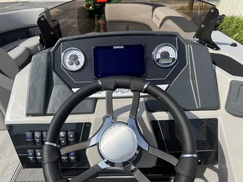 Slide: The Image of 2026 Starcraft SLS 3 Q DH helm with steering wheel and instruments. - 24