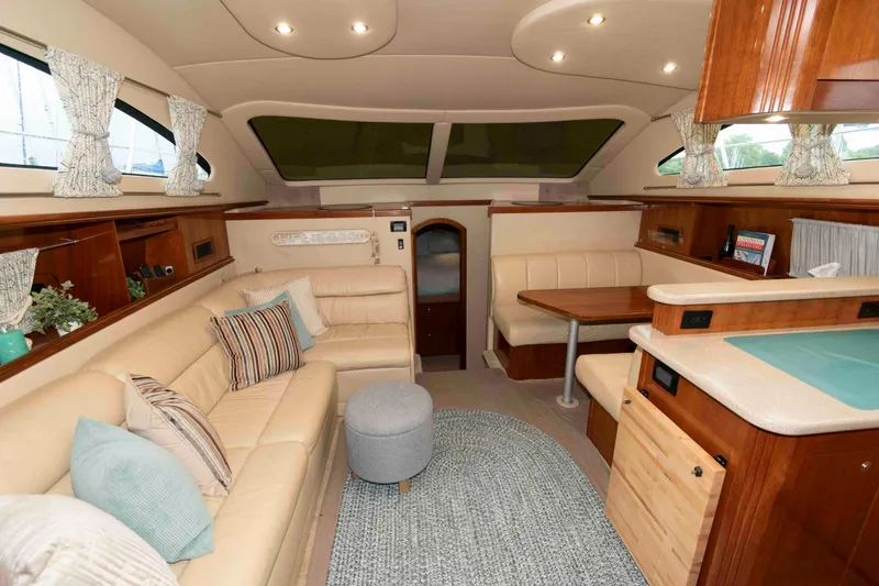 Slide: The Image of Luxurious interior of 2003 Cruisers Yachts 4050 Express with plush seating and elegant decor. - 16