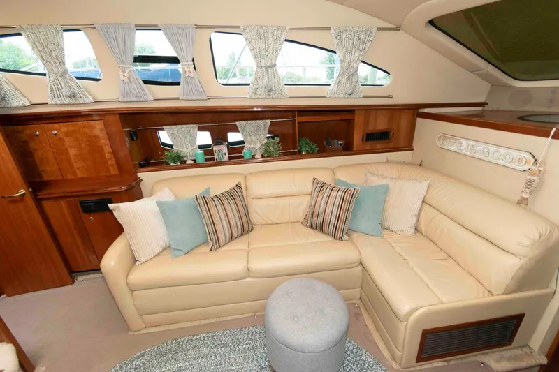 Slide: The Image of Luxurious interior of 2003 Cruisers Yachts 4050 Express with plush seating and elegant decor. - 17