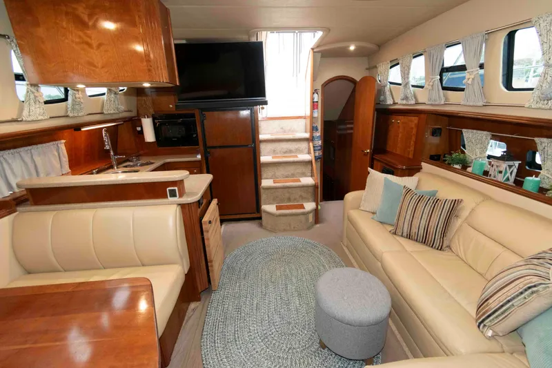 Slide: The Image of Luxurious interior of 2003 Cruisers Yachts 4050 Express with elegant seating and modern amenities. - 20