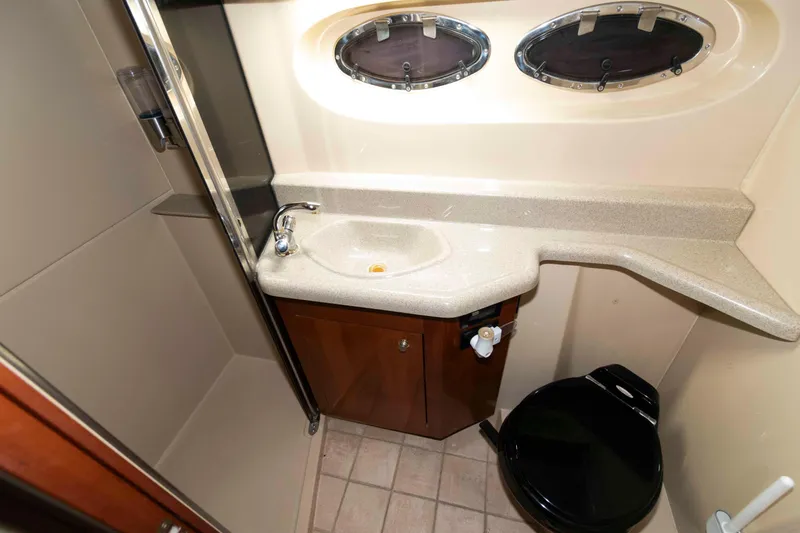 Slide: The Image of Bathroom interior of 2003 Cruisers Yachts 4050 Express with sink and toilet. - 24