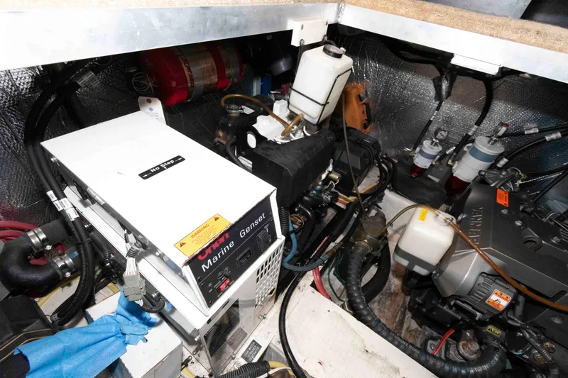 Slide: The Image of Engine room of 2003 Cruisers Yachts 4050 Express with marine generator and components. - 29