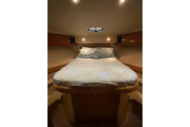 Slide: The Image of Luxurious cabin interior of 2003 Cruisers Yachts 4050 Express with cozy bedding. - 6