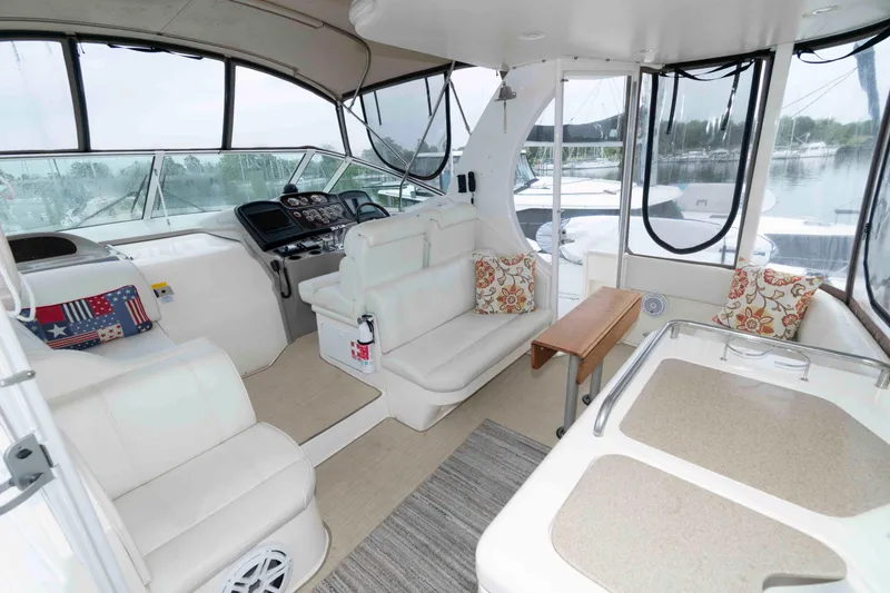Slide: The Image of Luxurious interior of 2003 Cruisers Yachts 4050 Express with plush seating and elegant design. - 9