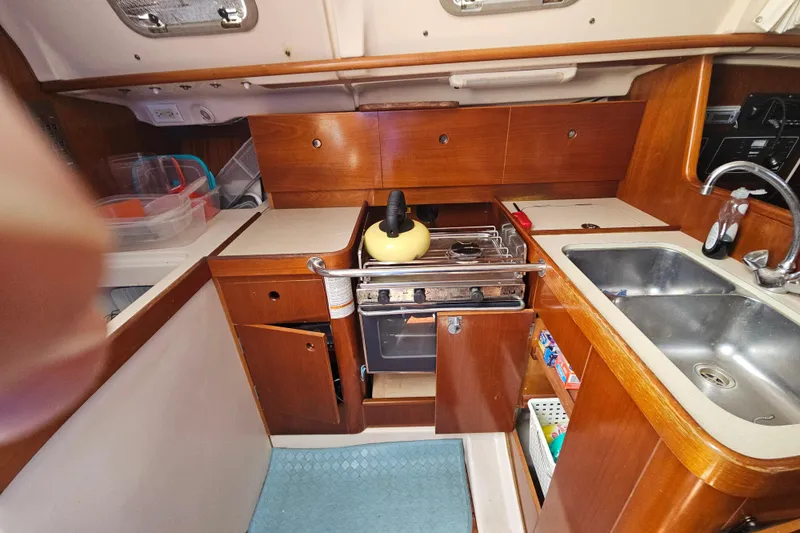 Slide: The Image of Interior view of 1997 Beneteau Oceanis Clipper 321 yacht kitchen area. - 22