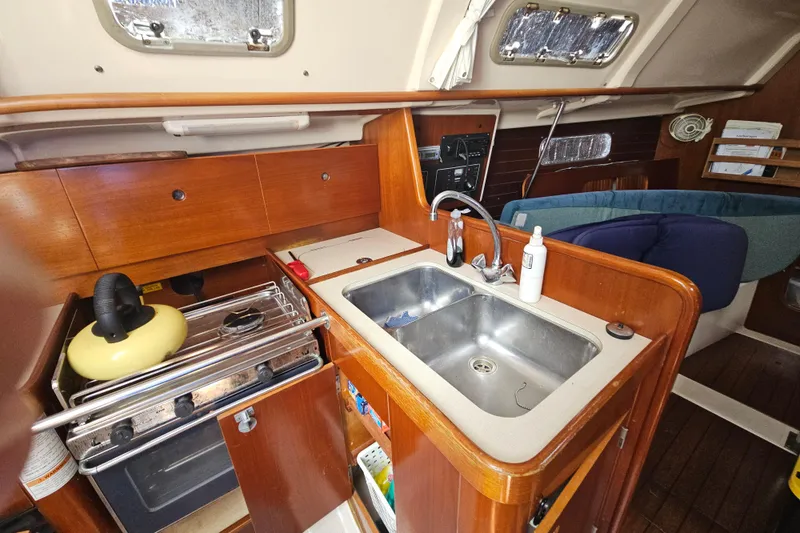 Slide: The Image of Control panel of a 1997 Beneteau Oceanis Clipper 321 sailboat with radio and switches. - 23
