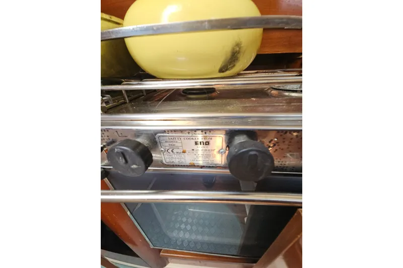 Slide: The Image of Navigation station on a 1997 Beneteau Oceanis Clipper 321 sailboat, featuring control panel and desk. - 24