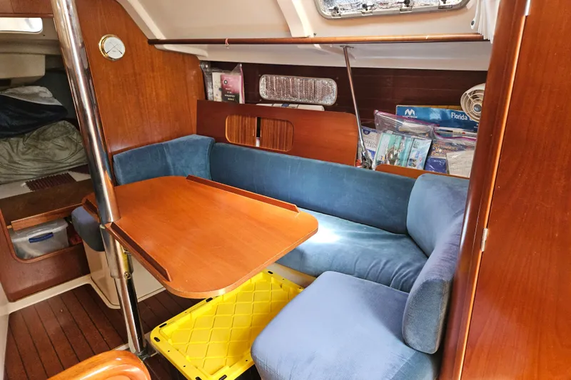 Slide: The Image of Interior cabin of 1997 Beneteau Oceanis Clipper 321 sailboat with blue cushions. - 30