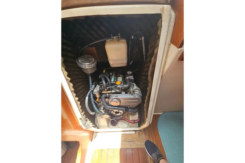Slide: The Image of Engine of a 1997 Beneteau Oceanis Clipper 321 sailboat, featuring detailed components. - 42