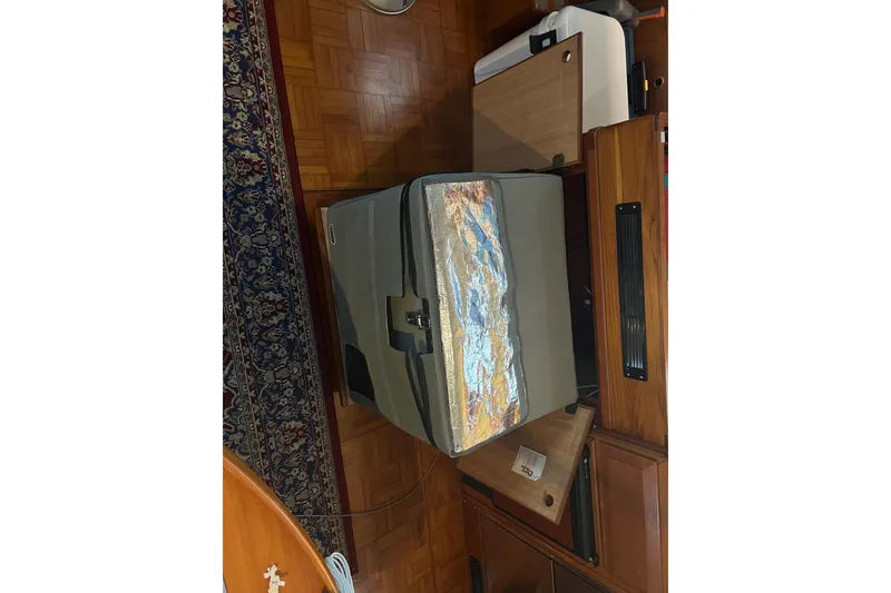 Slide: The Image of Interior of 1998 DeFever 44 Sundeck Trawler with cooler and wooden cabinetry. - 7