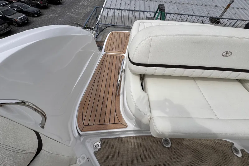Slide: The Image of Luxury seating on 2018 Cobalt R35 boat with teak flooring and white upholstery. - 11
