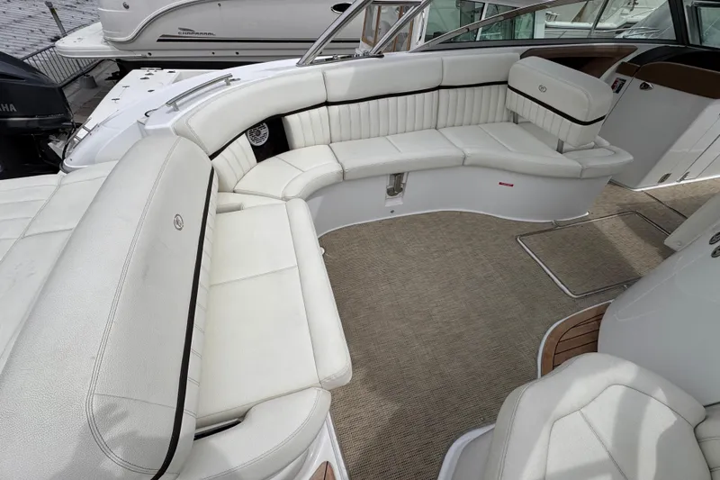 Slide: The Image of Luxurious seating area on a 2018 Cobalt R35 boat with white upholstery. - 13