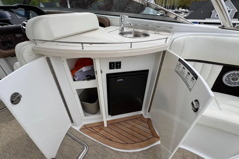 Slide: The Image of Luxury boat interior with sink, mini fridge, and storage in a 2018 Cobalt R35. - 19