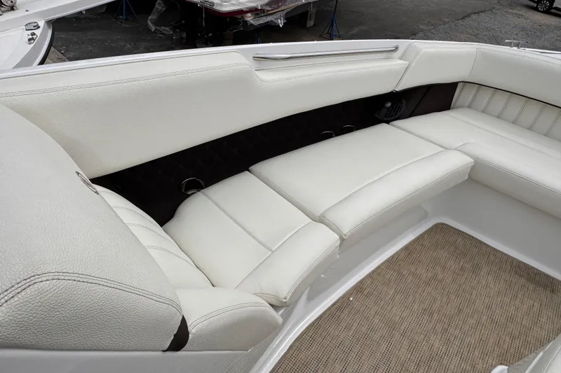 Slide: The Image of Luxurious white seating in 2018 Cobalt R35 boat, featuring elegant design and comfortable upholstery. - 22