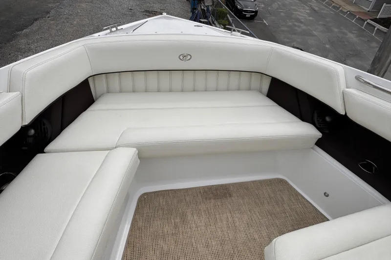 Slide: The Image of Luxurious seating area on a 2018 Cobalt R35 boat, featuring white upholstery and spacious design. - 23