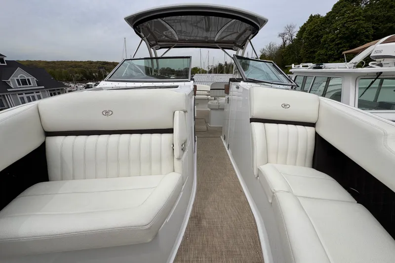 Slide: The Image of Luxurious 2018 Cobalt R35 boat interior with white seating and sleek design. - 25