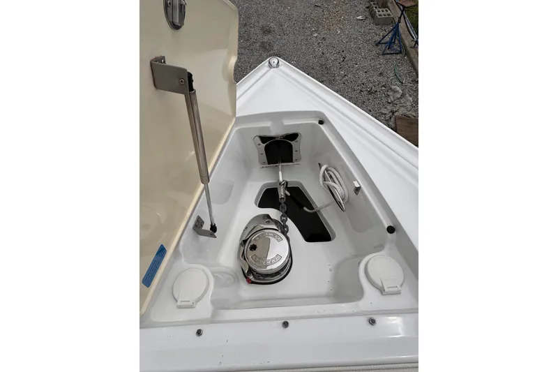 Slide: The Image of Open anchor compartment of 2018 Cobalt R35 boat, showing anchor chain and storage. - 29