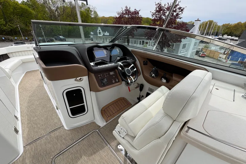 Slide: The Image of Helm of 2018 Cobalt R35 boat with modern controls and comfortable seating. - 33