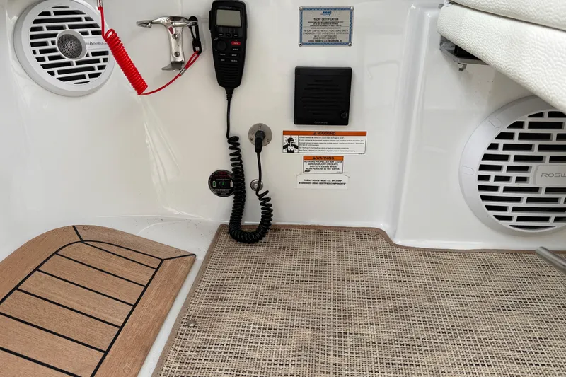 Slide: The Image of Interior of 2018 Cobalt R35 boat with radio, speakers, and safety equipment. - 38