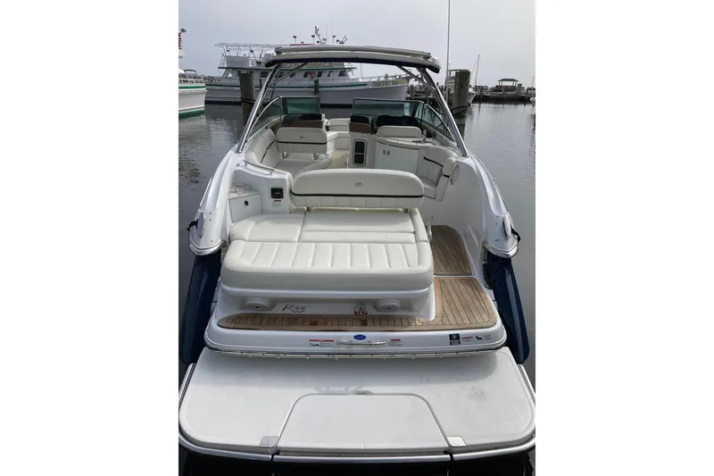 Slide: The Image of 2018 Cobalt R35 boat with spacious seating, docked at a marina. - 4