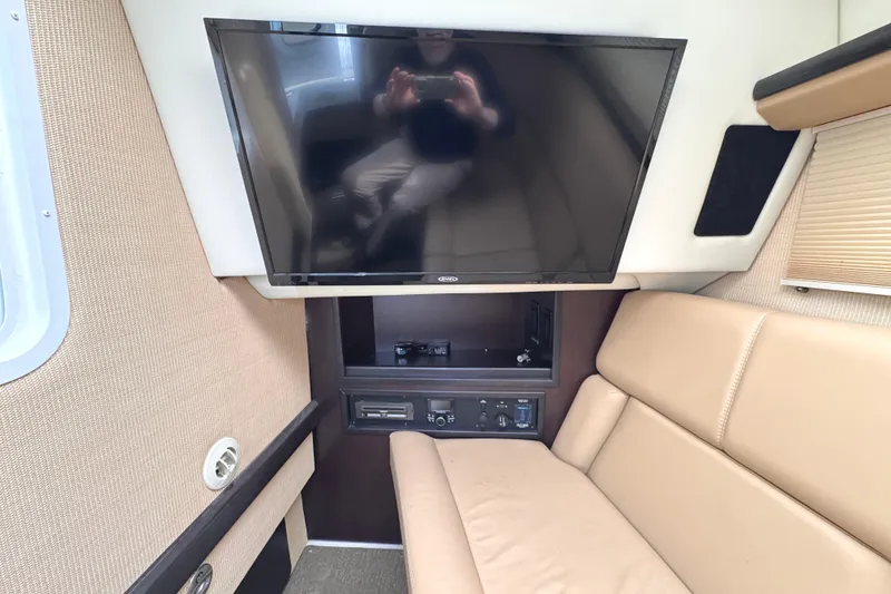 Slide: The Image of Luxurious interior of 2018 Cobalt R35 with TV and beige seating. - 41