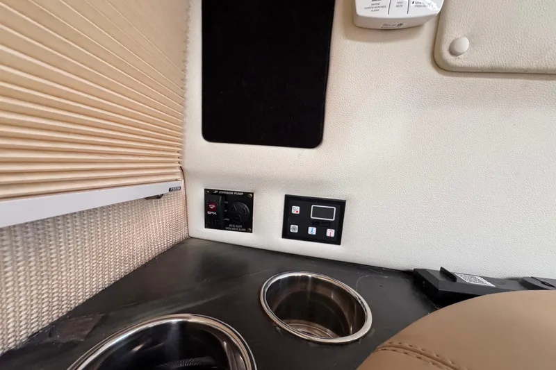 Slide: The Image of Interior of 2018 Cobalt R35 featuring control panels and cup holders. - 44