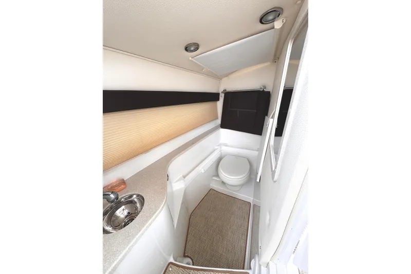 Slide: The Image of 2018 Cobalt R35 boat interior bathroom with sink and toilet. - 45
