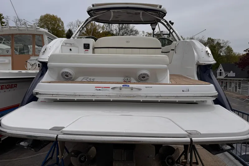Slide: The Image of 2018 Cobalt R35 boat with spacious deck and seating, docked at marina. - 7