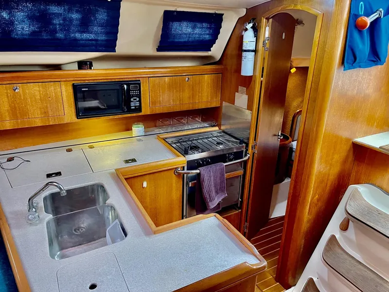 Slide: The Image of Interior of a 2002 Hunter 356 yacht kitchen. - 27