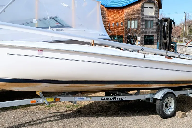 The Image of 2016 Flying Scot 19 sailboat on Load Rite trailer, parked outdoors. - 0
