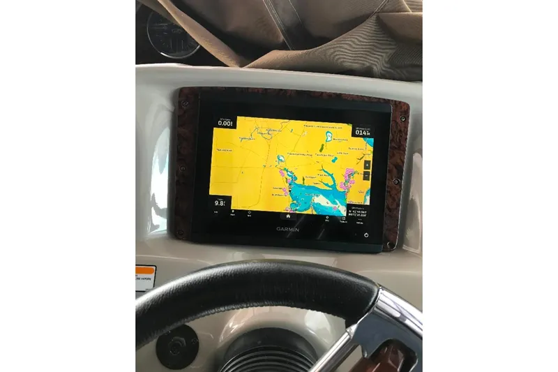 Slide: The Image of Garmin navigation display on 2006 Sea Ray 300 Sundancer boat dashboard. - 8