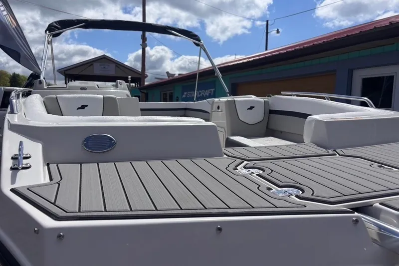 Slide: The Image of 2026 Starcraft SVX 191 OB boat with sleek deck design and comfortable seating. - 6