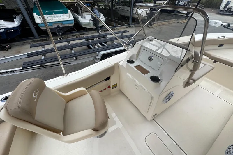 Slide: The Image of 2022 Scout 195 Sport Dorado boat interior with helm and seating area. - 10