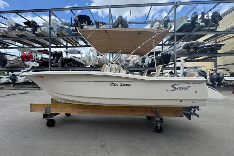 Slide: The Image of 2022 Scout 195 Sport Dorado boat on display, featuring sleek design and canopy. - 3