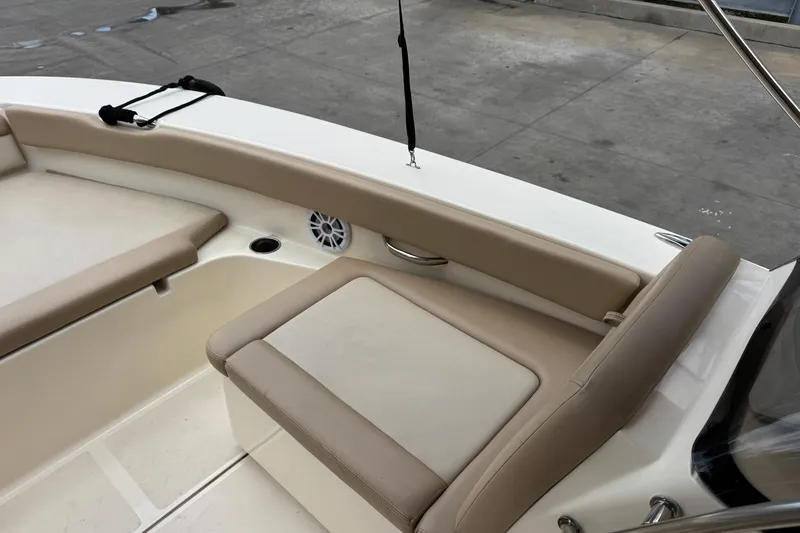 Slide: The Image of 2022 Scout 195 Sport Dorado boat interior with beige seating and speaker. - 5