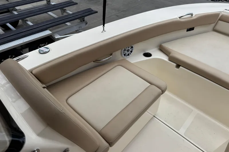 Slide: The Image of 2022 Scout 195 Sport Dorado boat interior with beige seating and speaker. - 6
