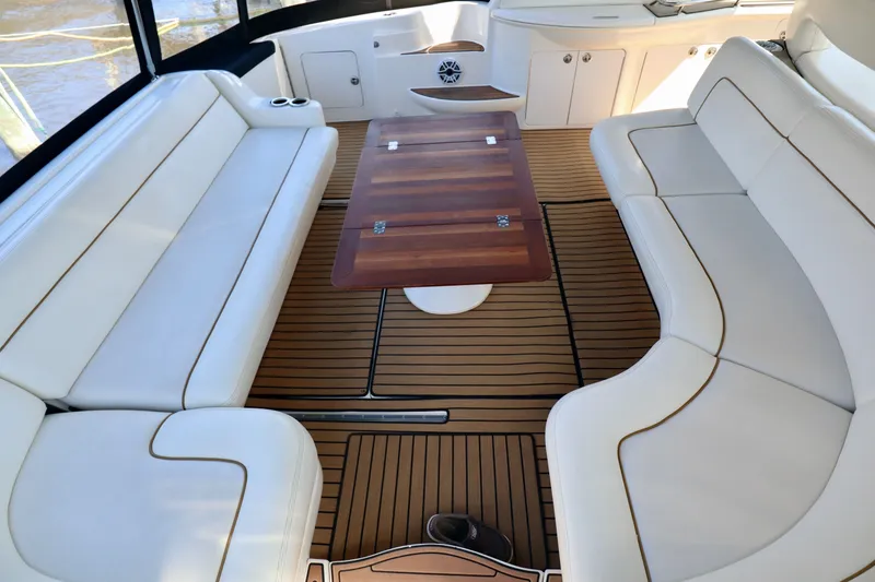 Slide: The Image of Interior of a 1999 Sea Ray Sundancer 460 yacht with wooden table. - 37