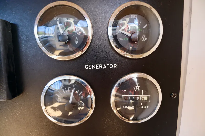 Slide: The Image of Generator gauges of the 1999 Sea Ray Sundancer 460. - 45
