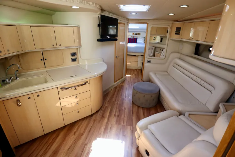 Slide: The Image of Interior of 1999 Sea Ray Sundancer 460 yacht with modern amenities. - 12