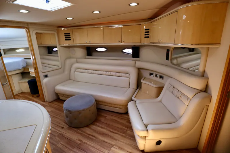 Slide: The Image of Interior of a 1999 Sea Ray Sundancer 460 yacht with elegant leather seating. - 22