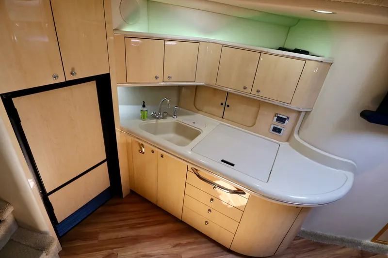 Slide: The Image of Interior of 1999 Sea Ray Sundancer 460 yacht kitchen. - 26